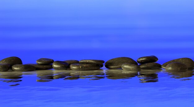 Ряд камней дзен на синем фоне
