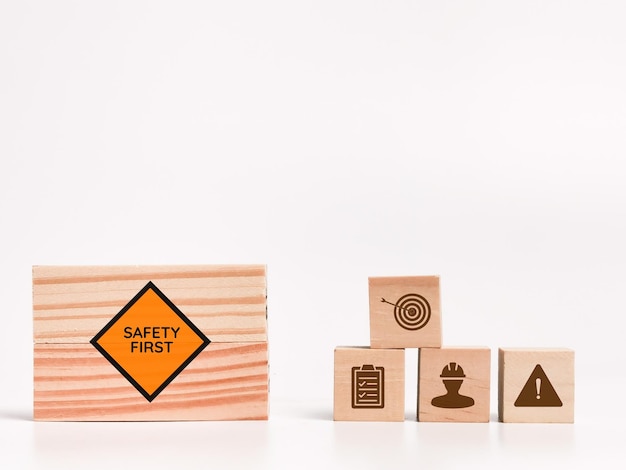 Zero accident concept on wooden blocks with icons against white background.