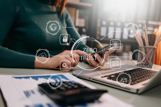 Zero trust security concept Person using computer and tablet with zero trust icon on virtual screen of Data businessesin officexA