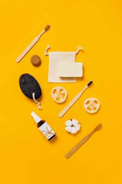 Photo zero waste accessories on yellow background