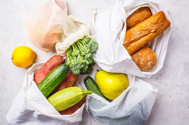 Zero waste concept. Eco bags with fruits and vegetables, eco friendly vegan flat lay, plastic free