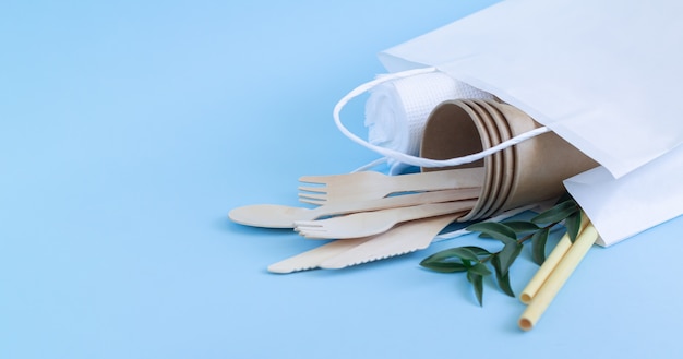 Zero waste concept, eco biodegradable tableware and cutlery in paper bag