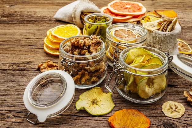 Zero waste food shopping concept. Assortment of dried fruits, walnuts. Sustainable lifestyle