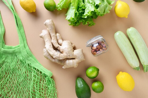Zero waste Healthy vegan goods mesh bag lime ginger salad vegetables Sustainable lifestyle View from above