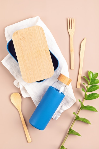 Zero waste kit for takeaway lunch, reusable bottle, box and bamboo cutlery. Sustainable lifestyle concept