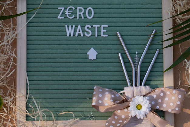 Zero Waste and metallic drinking straws set in a jute sack Closeup