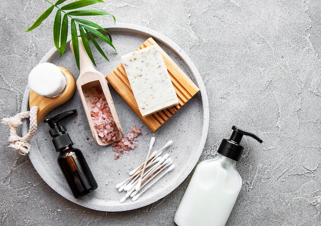 Zero waste natural cosmetics products on concrete background. Flat lay.