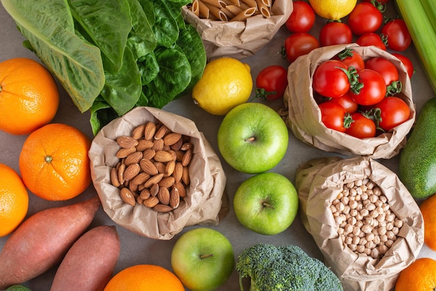 Zero waste packaging Different vegetables and fruits in paper bags on the table