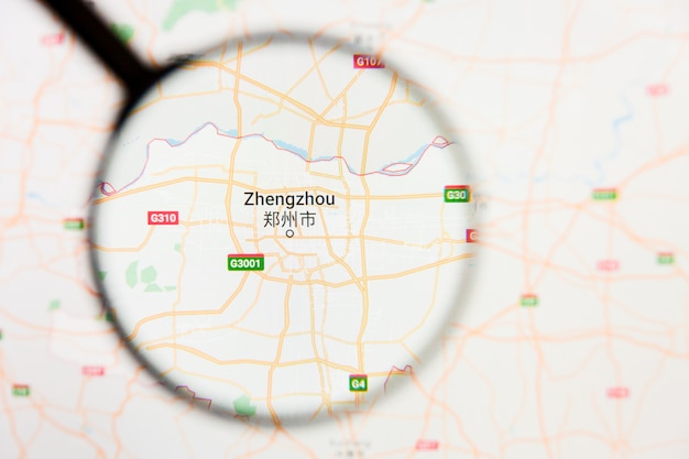 Foto zhengzhou, concetto illustrativo di visualizzazione della città della cina sullo schermo di visualizzazione tramite la lente d'ingrandimento