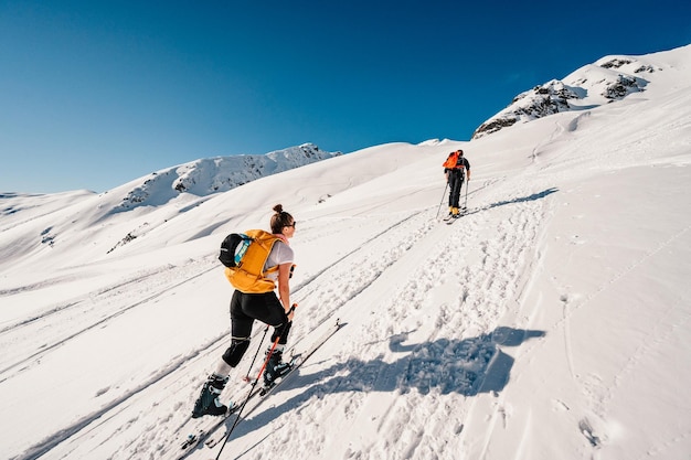 Ziarska dolina slovakia 1022022 Mountaineer backcountry ski walking ski alpinist in the mountains Ski touring in alpine landscape with snowy trees Adventure winter sport