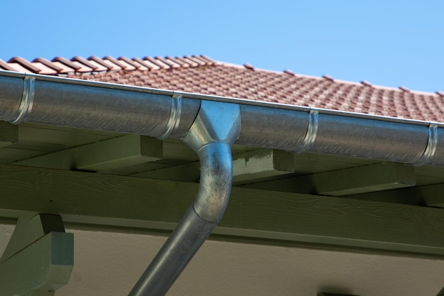 Zinc gutter silver and pipe house construction new gray metal tile roof with gray rain gutters