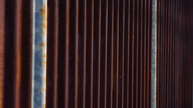 The zinc wall is rusty, beautifully patterned, used as a background image.