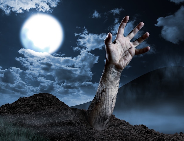 Zombie hand coming out of his grave