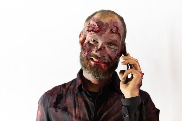 Zombie male makeup for halloween concept. Blood on skin face