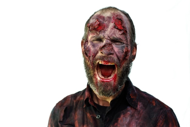 Zombie male makeup for halloween concept. Blood on skin face