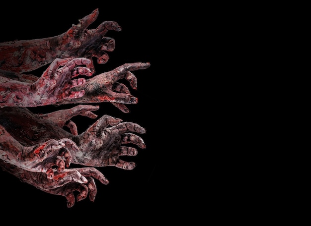 Zombies or monsters hand attacking, attack or nightmare concept, isolated black background