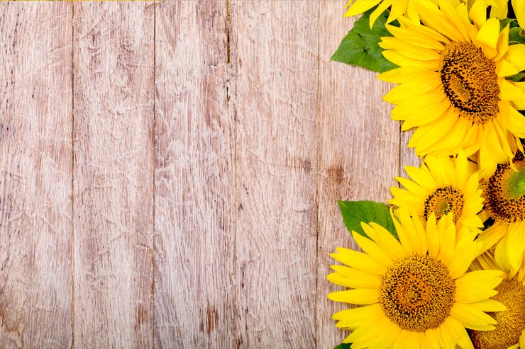 Foto zonnebloemen e op het houten oppervlak