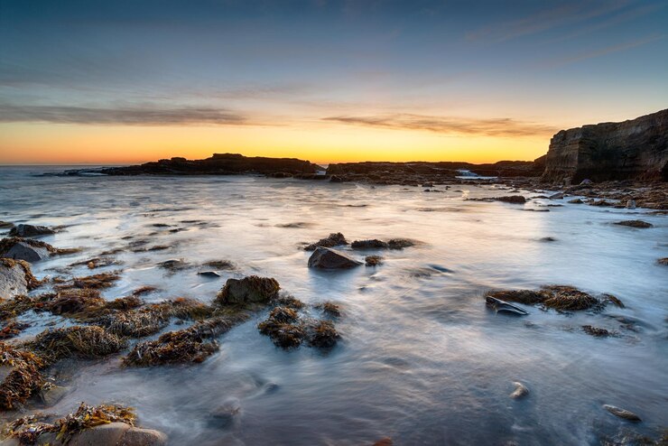 Foto zonsopgang bij howick haven beach