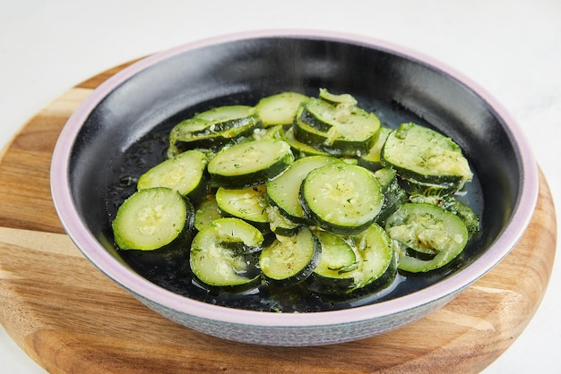 Zucchini cut into slices steamed with herbs