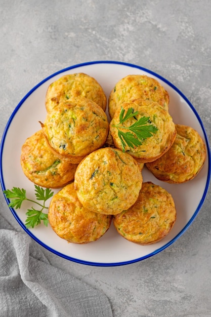 zucchini muffins with cheese garlic and herbs Vegetarian dish Copy space