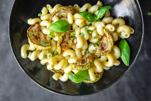 Zucchini pasta vegetables and macaroni no meat fresh portion ready to eat meal snack on the table