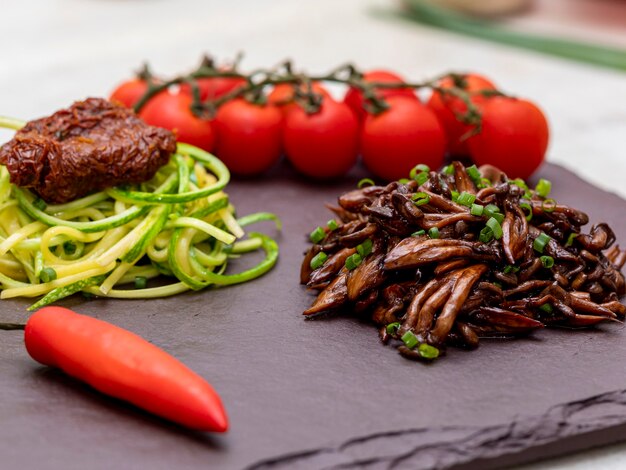 Zucchini spaghetti with dehydrated  and  dried tomatoes