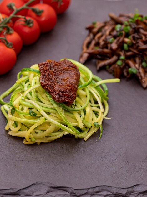 Zucchini spaghetti with dehydrated  and  dried tomatoes