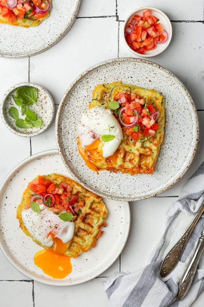 Zucchini waffles with tomato tartare and poached egg