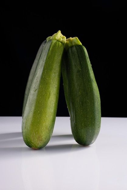 Zucchini zucchini on black and white background Minimalistic concept