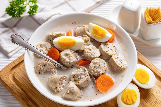 Zurek polish rye soup on a white wooden background