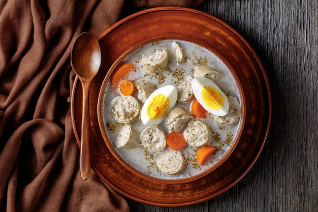 Zurek polish soup with white kielbasa on a bowl