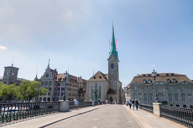 Zurich Switzerland 1 August 2019 Panorama view of historic city center of Zurich with Fraumunster Church and Munsterbucke crossing river Limmat