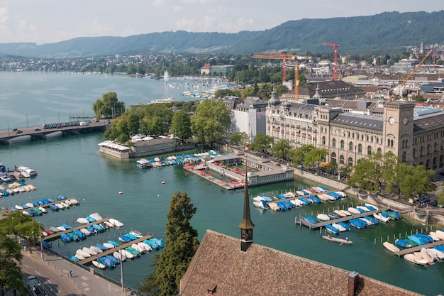 Zurich, Switzerland - June 19, 2017: Aerial view of historic Zurich city center and river Limmat from Grossmunster Church, Switzerland. Summer landscape