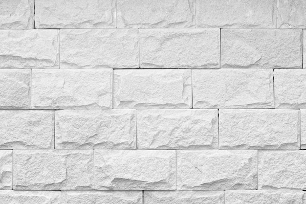 Zwart-wit schot van de textuurachtergrond van de bakstenen muurdecoratie
