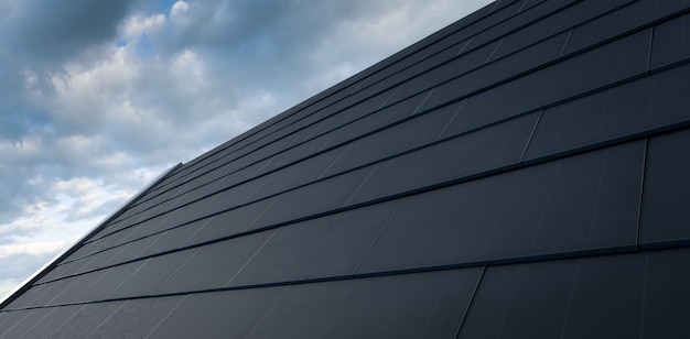 Zwart zonnedakconcept. gebouwgeïntegreerd fotovoltaïsch systeem bestaande uit moderne monokristallijne zwarte zonnedakpannen. 3d-rendering.