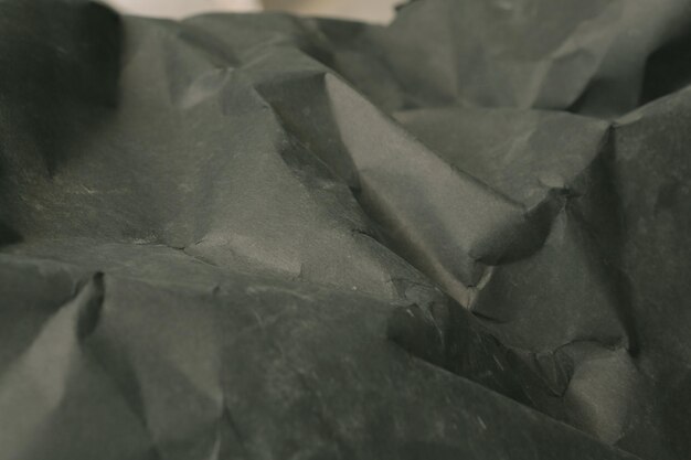 zwarte gevouwen verfrommeld papier achtergrond grunge textuur backdrop