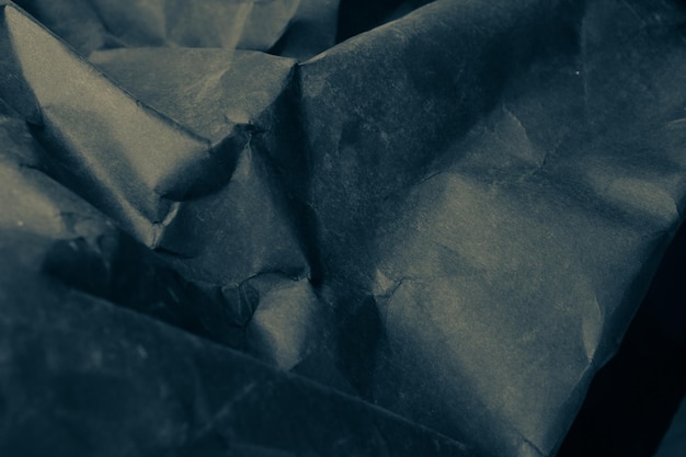 zwarte gevouwen verfrommeld papier achtergrond grunge textuur backdrop