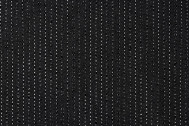Zwarte krijtstreep stof met kleine witte stippen gebruikt voor de productiekwaliteit van kleding