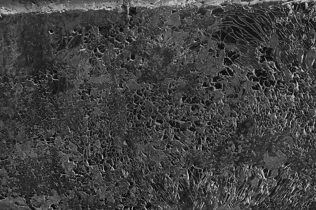 zwarte oude muur gebarsten betonnen achtergrond / abstracte zwarte textuur, vintage oude achtergrond