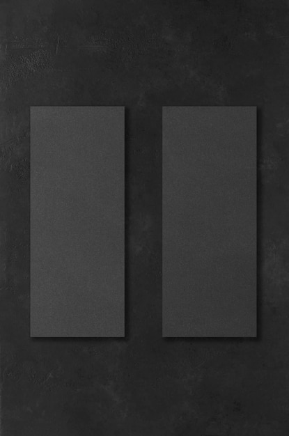 Zwarte rechthoekige mockups op een donkere betonnen achtergrond Ontwerpelementen of portfolio Ruimte kopiëren