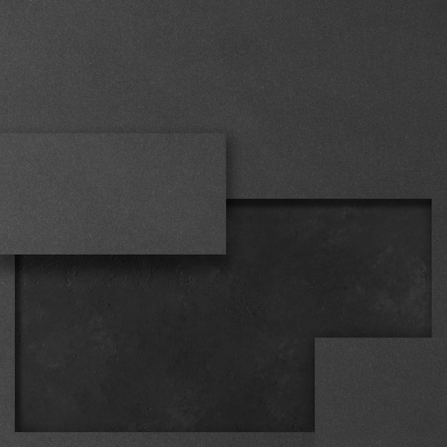 Zwarte rechthoekige mockups op een donkere betonnen ondergrond. Ontwerpelementen of portfolio. Ruimte kopiëren.