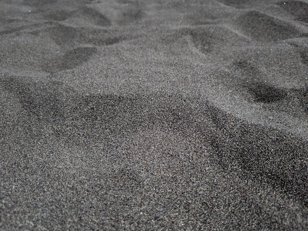 zwarte strand zandduinen textuur