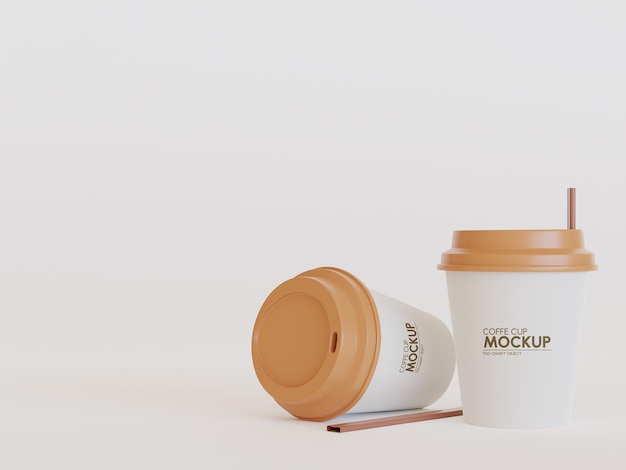 2 piccole tazze bianche di caffè in piedi e mockup che cadono