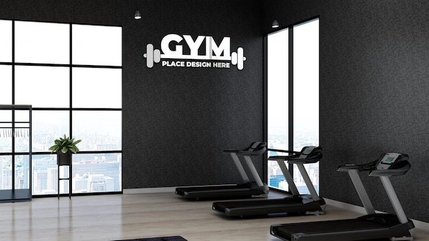 PSD 3d макет логотипа спортзала в фитнес-зале с черной стеной для спортсмена