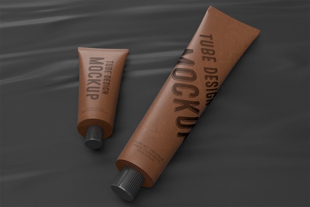 3d packaging design mockup of two lying vintage leather tubes