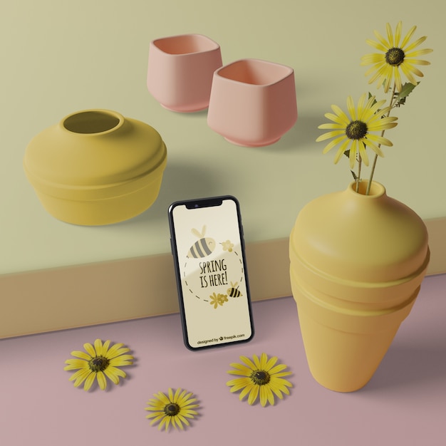 PSD vasi 3d con fiori accanto al cellulare con mock-up