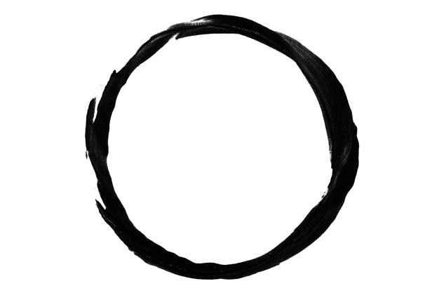 a smear or imprint of black paint in the form of a circle on a blank background