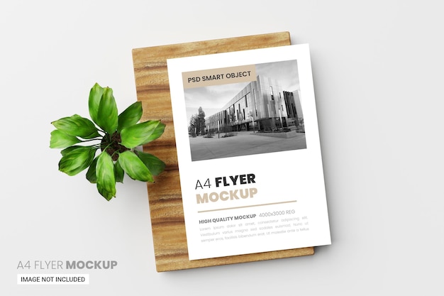 PSD a4 flyer poster mockup in 3d render with green leaf and wooden background