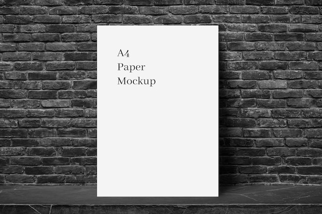 A4 Paper Mockup on Black Brick Background