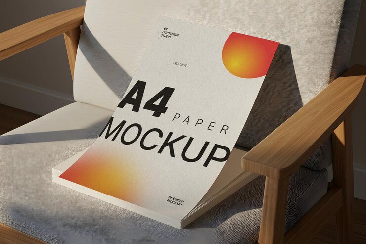 A4 paper mockup on chair armrest in cozy natural light setting